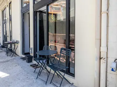 a table and chairs sitting in front of a window at Modern a c apartment 2BR 8P - Cannes in Cannes