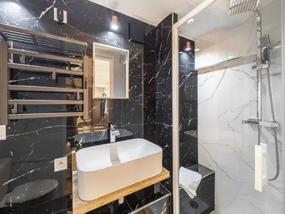 a bathroom with a sink and a shower at Modern a c apartment 2BR 8P - Cannes in Cannes