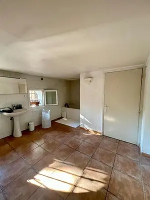 an empty room with a bathroom and a sink at Large duplex with garden in historic house in Le Cannet
