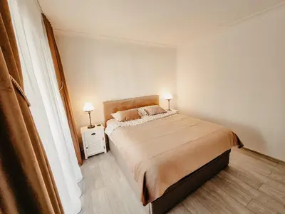 a bedroom with a bed with two lamps on it at Appartement centre Cannes Soleil - 2 rooms in Cannes