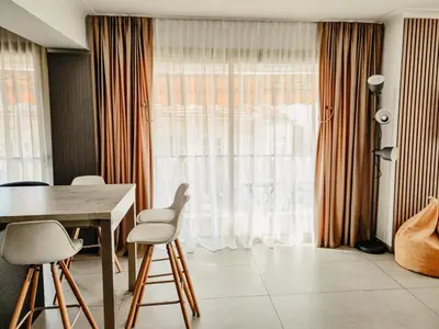 a dining room with a table and chairs and a window at Appartement centre Cannes Soleil - 2 rooms in Cannes