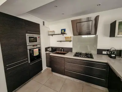 a kitchen with a sink and a stove top oven at Appartement centre Cannes Soleil - 2 rooms in Cannes