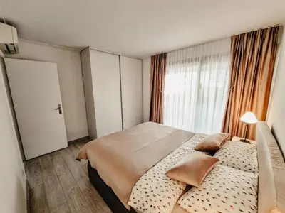 a bedroom with a large bed and a window at Appartement centre Cannes Soleil - 2 rooms in Cannes