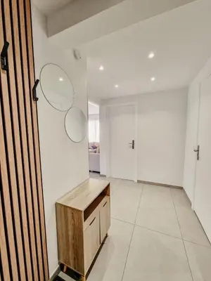 a room with a wooden desk and a hallway at Appartement centre Cannes Soleil - 2 rooms in Cannes