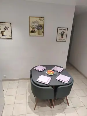 a table in a room with a bowl of food on it at Cannes centre T3 Carré D'Or calme air conditionné WiFi in Cannes