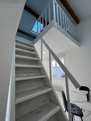 a staircase leading up to the second floor of a house at La petite MAISON BLANCHE CANNES in Cannes