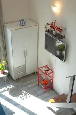 a room with a white cabinet and a shelf at Sweet Holiday by Connexion in Cannes