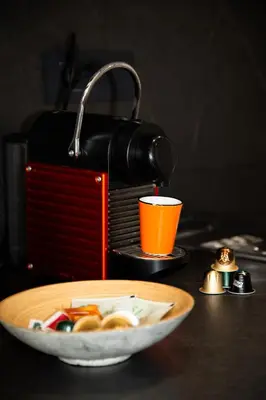 a bowl of food and an orange cup on a table at Sweet Holiday by Connexion in Cannes