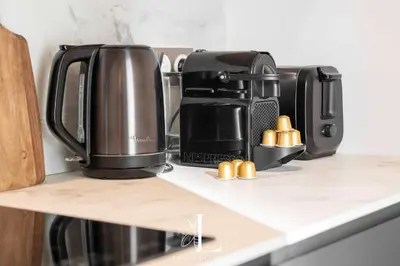 a coffee maker on a counter in a kitchen at Les Lucioles 3 - Luxury Studio Apartment in Cannes