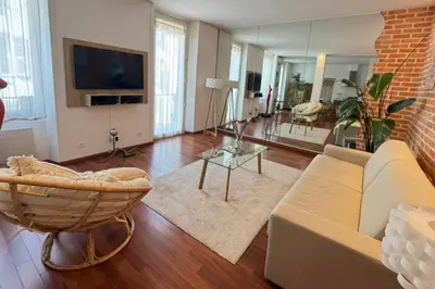 a living room with a couch and a tv at One bedroom with balcony Rue Chabaud in Cannes