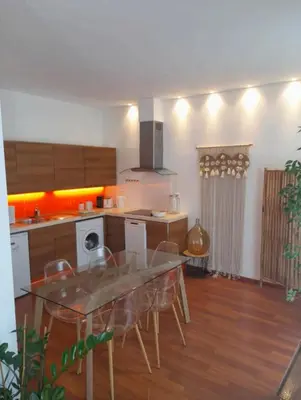 a kitchen with a table and chairs in a room at One bedroom with balcony Rue Chabaud in Cannes