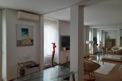 a living room with a glass table and a living room with at One bedroom with balcony Rue Chabaud in Cannes