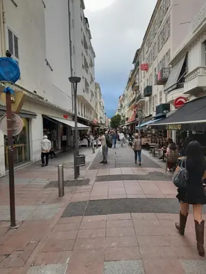 a group of people walking down a city street at One bedroom with balcony Rue Chabaud in Cannes