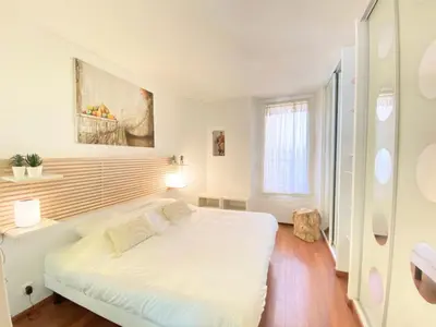 a bedroom with a large white bed in a room at One bedroom with balcony Rue Chabaud in Cannes