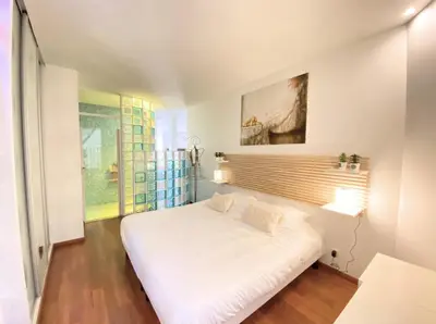 a bedroom with a white bed and a window at One bedroom with balcony Rue Chabaud in Cannes