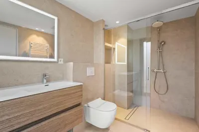a bathroom with a toilet and a sink and a shower at REF 2021 -Cannes Centre Croisette - Apartment for rent in Cannes