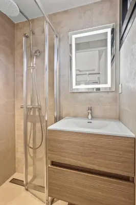 a bathroom with a sink and a mirror at REF 2021 -Cannes Centre Croisette - Apartment for rent in Cannes
