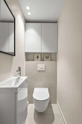 a bathroom with a white toilet and a sink at REF 2021 -Cannes Centre Croisette - Apartment for rent in Cannes
