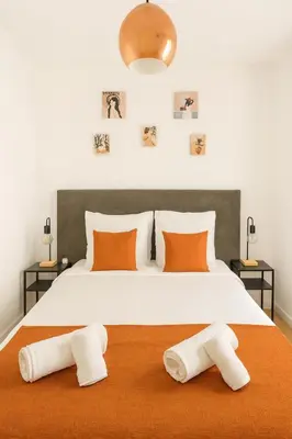 a living room with a couch and a table at Brise de Sauge 1BR cosy clim, proche Palais in Cannes