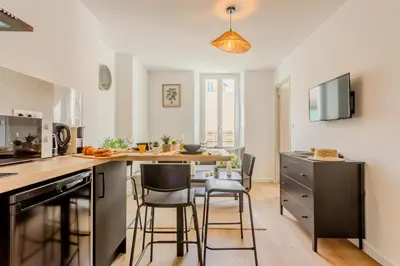 a bathroom with a toilet and a mirror at Brise de Sauge 1BR cosy clim, proche Palais in Cannes