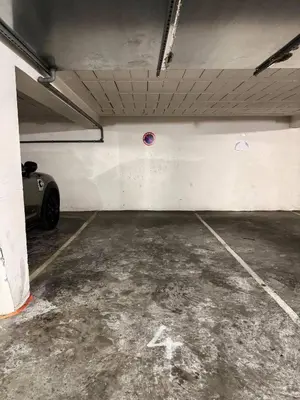 a parking garage with a car parked in it at Luxury Apartment with Sea View and Private Beach Access in Cannes