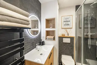 a bathroom with a sink and a shower at 13 PRAD - Renovated apartment for 3 travelers near Croisette in Cannes
