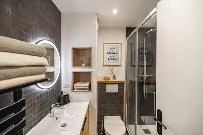 a bathroom with a shower and a sink and a toilet at 13 PRAD - Renovated apartment for 3 travelers near Croisette in Cannes
