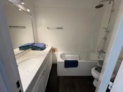 a bathroom with a sink and a toilet and a mirror at Studio lumineux, terrasse, clim, parking, centre ville in Cannes