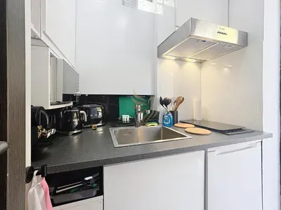 a kitchen with a sink and a counter top at Studio l'Atelier – Parking & Beaches 15 min Walk in Cannes