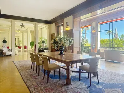 a dining room with a table and chairs at Studio l'Atelier – Parking & Beaches 15 min Walk in Cannes