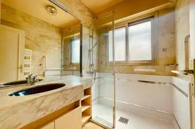 a bathroom with a sink and a shower at Cozy flat with terrace and swimming pool in Cannes in Cannes