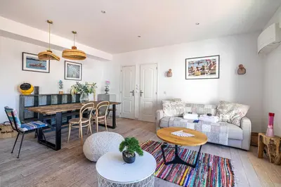 a living room with a couch and a table at Superb flat - 2BR- 4 P - Cannes in Cannes