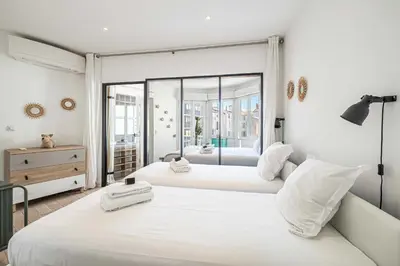 two white beds in a room with a large window at Superb flat - 2BR- 4 P - Cannes in Cannes