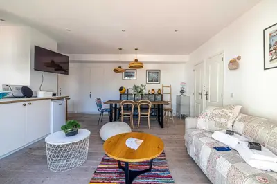 a living room with a couch and a table at Superb flat - 2BR- 4 P - Cannes in Cannes