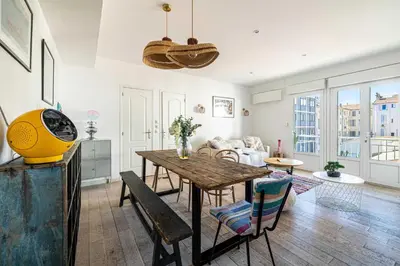 a living room with a wooden table and chairs at Superb flat - 2BR- 4 P - Cannes in Cannes