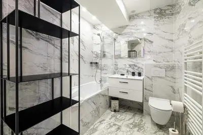 a bathroom with a toilet and a sink at Charming flat - AC - 2BR - 6P - Cannes in Cannes