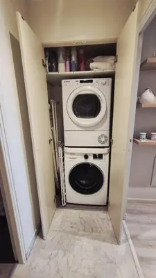 a washer and dryer in a small room at Beautiful 2-bedroom apt - sea and city view in Cannes