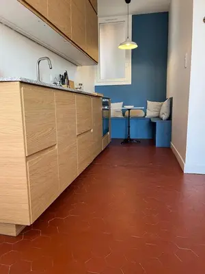 a kitchen with a sink and a couch in a room at Elégant appartement 2 pièces centre Cannes Croisette plages in Cannes