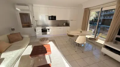a living room with a couch and a table at Avenue de Madrid 19 - Croisette Madrid in Cannes