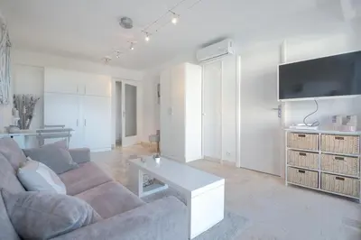 a living room with a couch and a coffee table at Wdf studio in the heart of Cannes! in Cannes