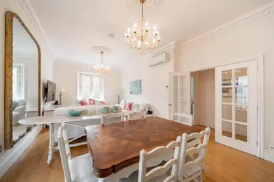 a dining room and living room with a table and chairs at Truly amazing 3 bedrooms Cannes center!! in Cannes