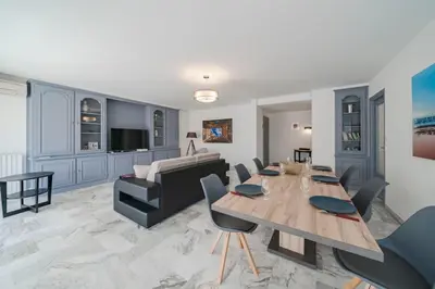 a living room with a table and a couch at Wdf 2 bedrooms heart of Cannes!! in Cannes