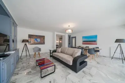 a living room with a couch and a table at Wdf 2 bedrooms heart of Cannes!! in Cannes