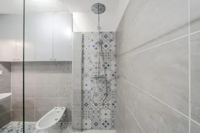 a bathroom with a shower and a sink at Wdf 2 bedrooms heart of Cannes!! in Cannes