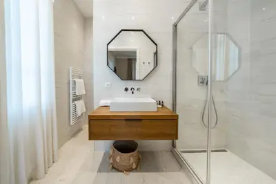 a bathroom with a sink and a mirror at Contemporary house in the center of Cannes with a pool and relaxation area in Cannes