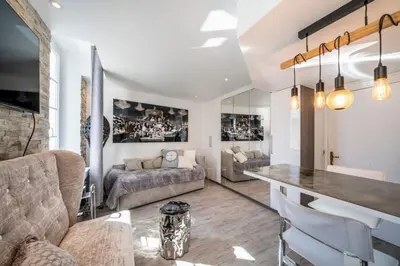 a living room with a couch and a table at Beautiful studio rue d'Antibes in Cannes