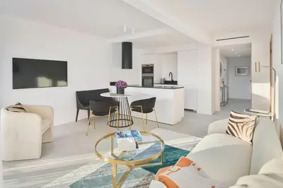 a living room with a couch and a table at Wdf 2 bedroom heart of Cannes in Cannes