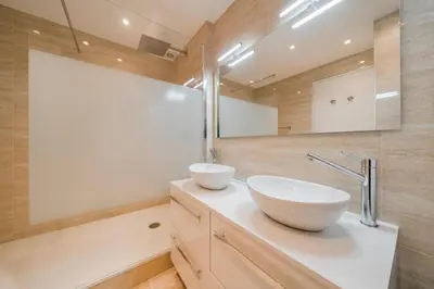 a bathroom with two white bowls on a counter at Wonderful 2 bedrooms with sea view and pool ! in Cannes