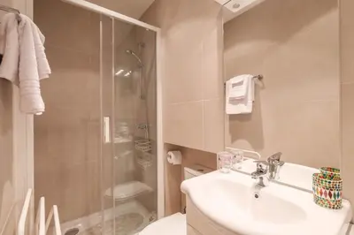 a bathroom with a sink and a shower at Cozystay 1087 - Charming studio historic Suquet in Cannes