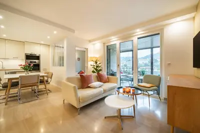a living room with a couch and a table at Beautiful two bedroom duplex apartment in Cannes
